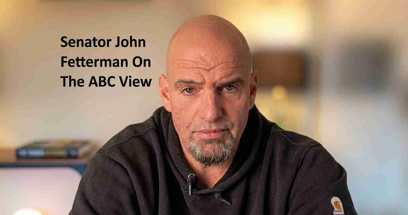 Portrait of a bald man with a goatee wearing a black hoodie, looking at the camera; left side contains the text: 'Senator John Fetterman On The ABC View'.