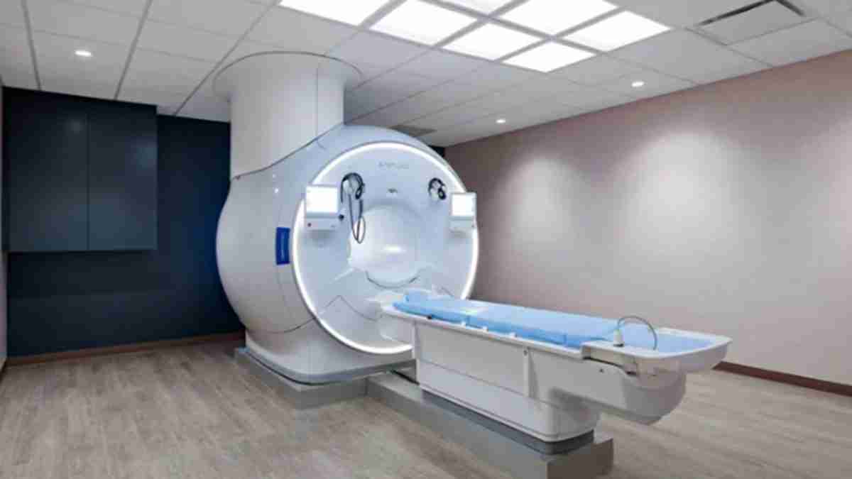 MRI scanner in a clinical imaging room with a patient table ready for scanning