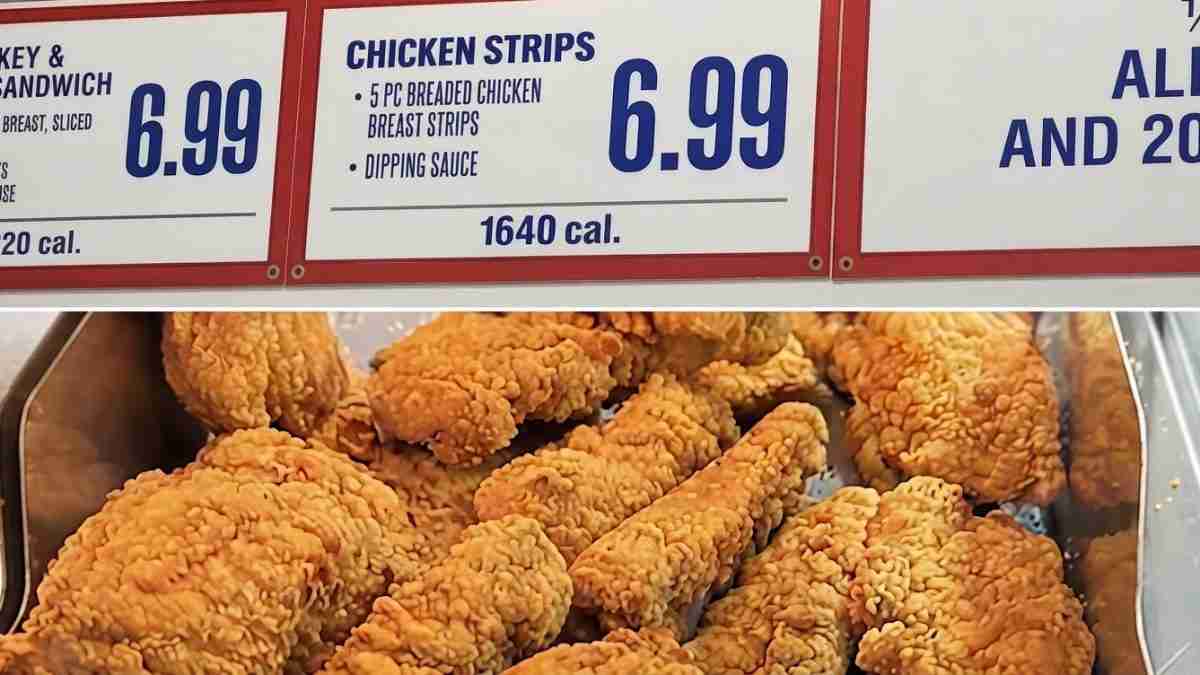 Tray of golden fried chicken strips in a serving tin, beneath a menu board showing 'Chicken Strips' for 6.99 and 1640 cal.