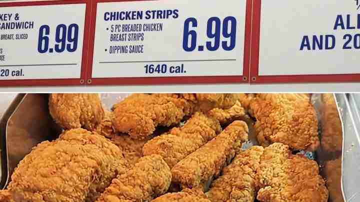 Tray of golden fried chicken strips in a serving tin, beneath a menu board showing 'Chicken Strips' for 6.99 and 1640 cal.